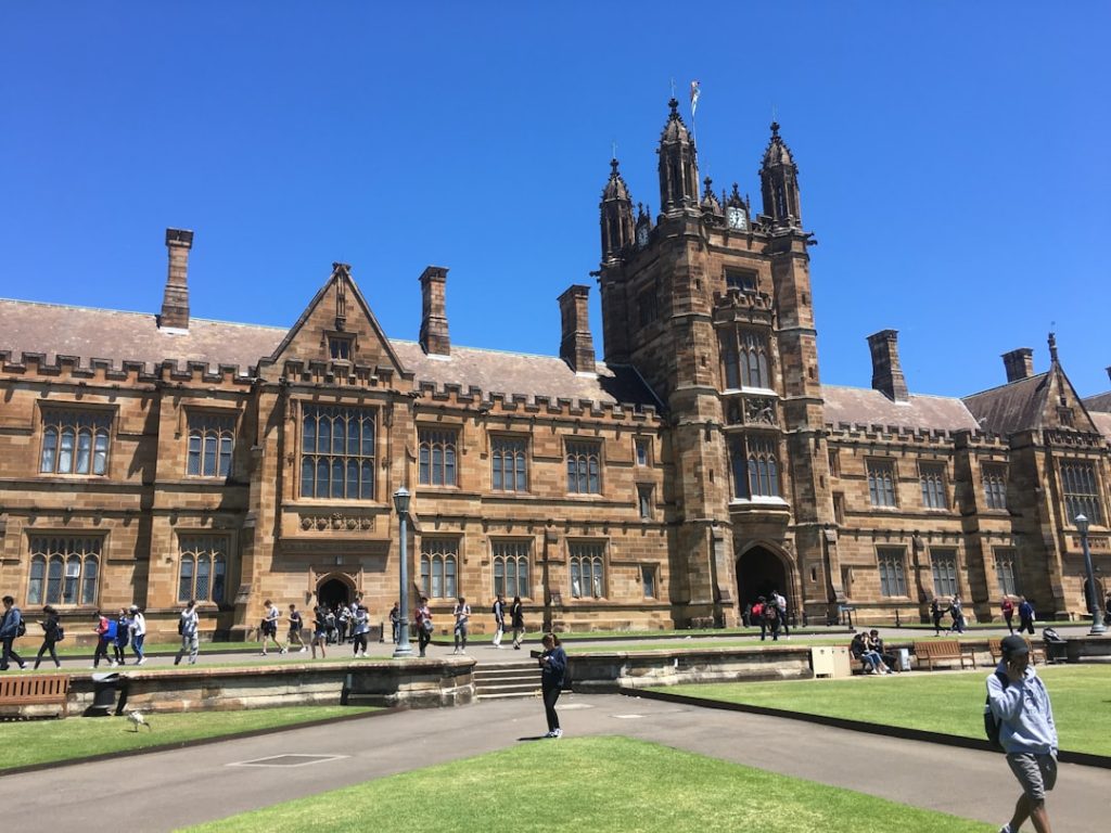 International students walking across a university campus